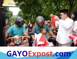 Semangat Kemerdekaan Bergelora, Ribuan Warga Antusias Terima Bendera Merah Putih dari Pemkab Aceh Tengah